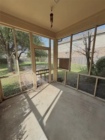a view of backyard with large windows