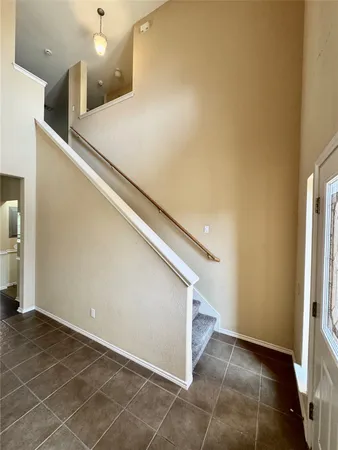 a view of a kitchen with a sink and a refrigerator