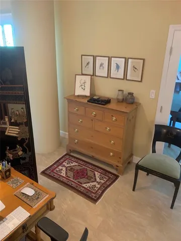 a room with furniture and a flat screen tv