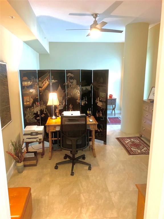 2301 Wilton Drive, Unit R409 Wilton Manors, FL 33305 - Photo 17 of 38 a living room with furniture and a fireplace