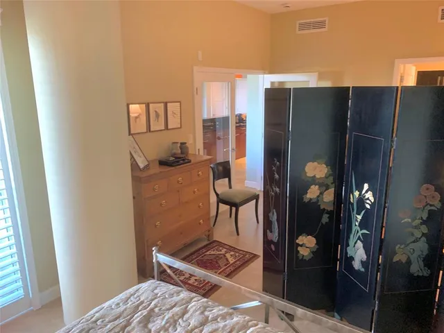 a kitchen with stainless steel appliances granite countertop a refrigerator and a stove