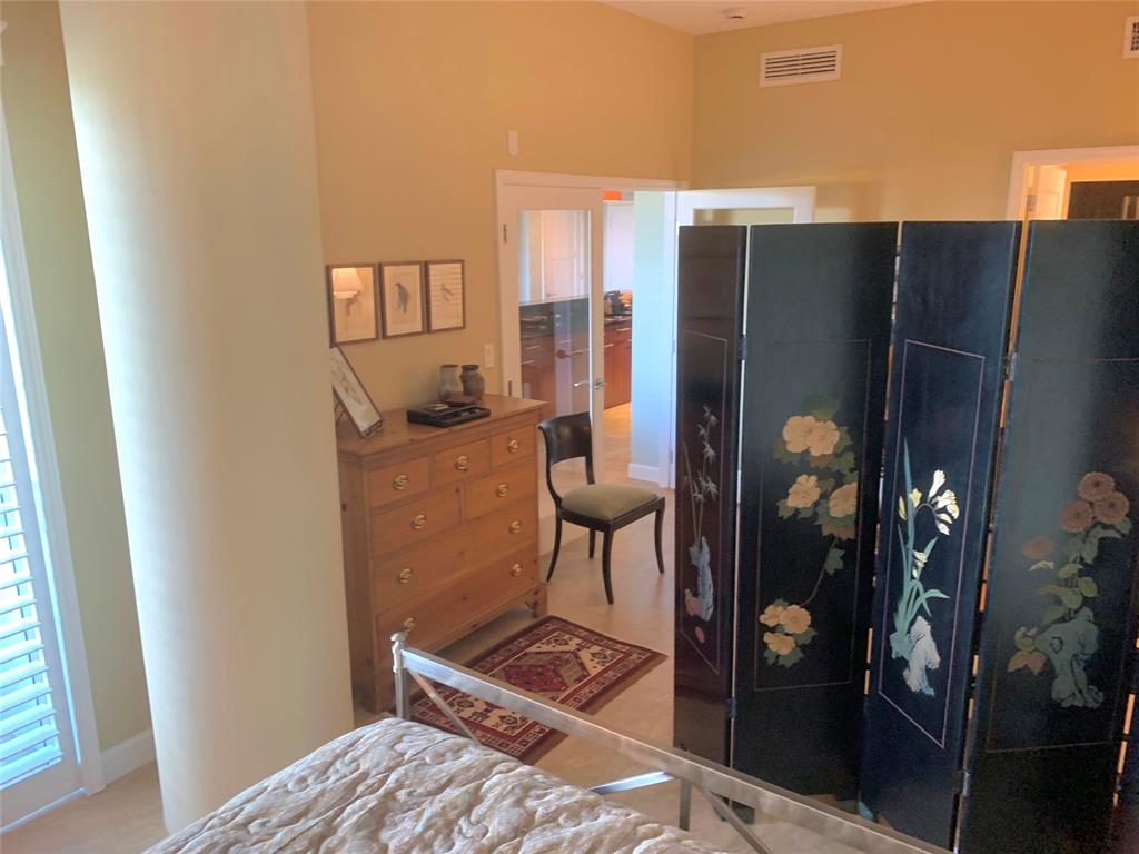 2301 Wilton Drive, Unit R409 Wilton Manors, FL 33305 - Photo 18 of 38 a kitchen with stainless steel appliances granite countertop a refrigerator and a stove