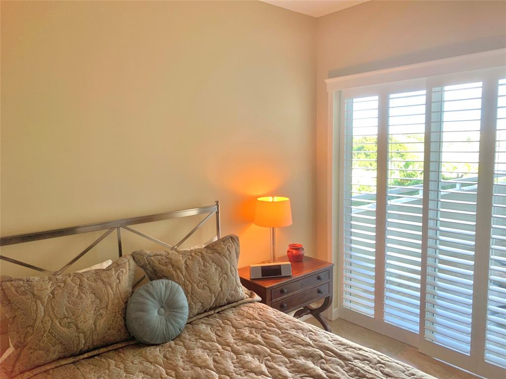 2301 Wilton Drive, Unit R409 Wilton Manors, FL 33305 - Photo 20 of 38 a bedroom with a bed and window