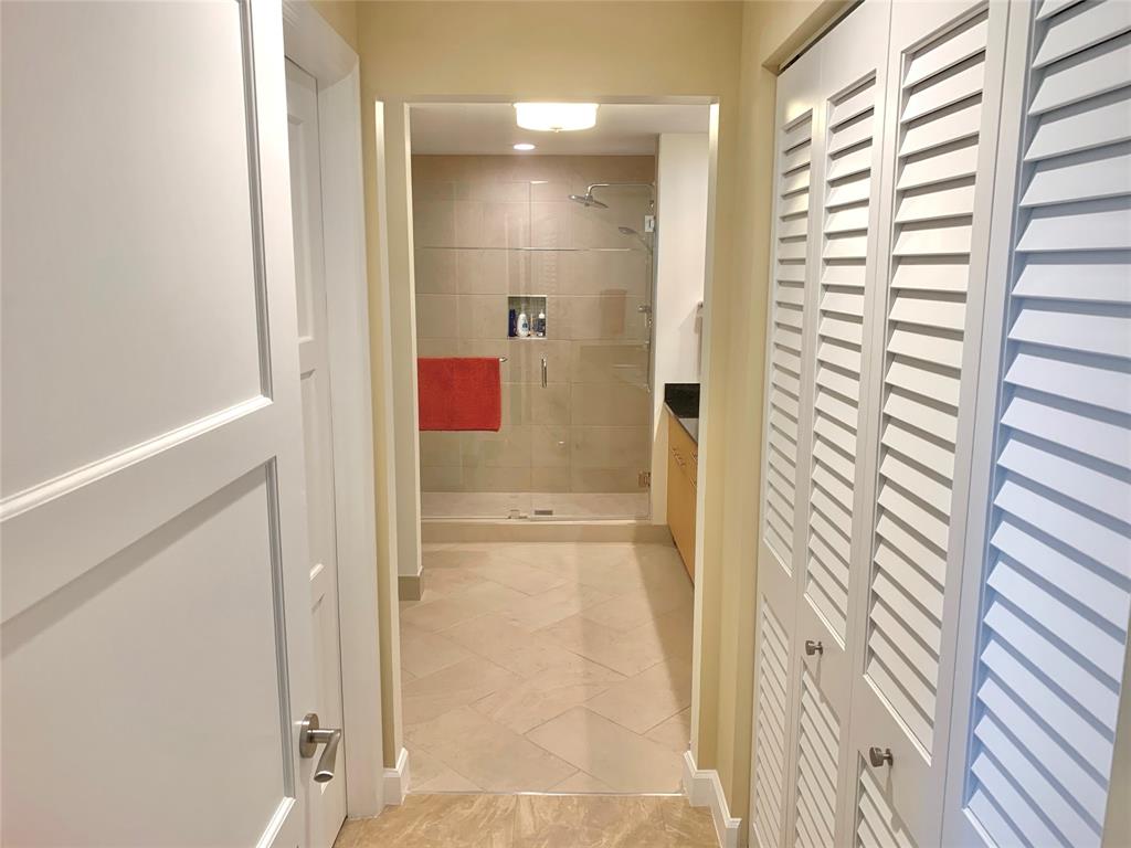 2301 Wilton Drive, Unit R409 Wilton Manors, FL 33305 - Photo 21 of 38 a bathroom with a shower and a sink