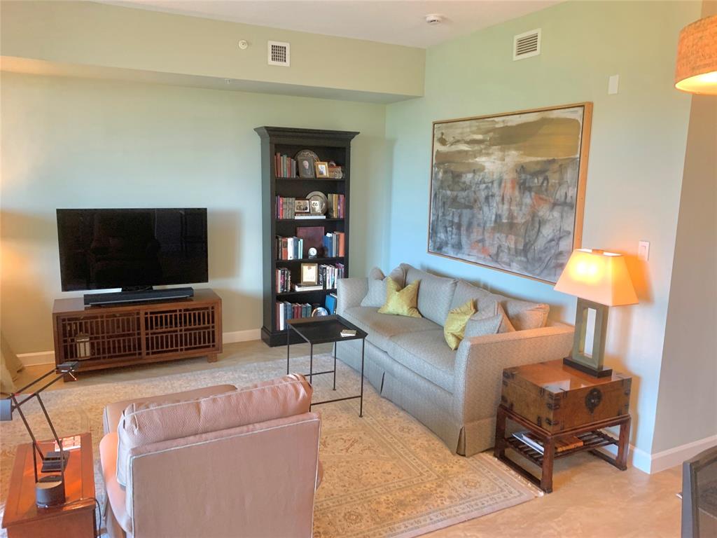2301 Wilton Drive, Unit R409 Wilton Manors, FL 33305 - Photo 4 of 38 a living room with furniture and a flat screen tv