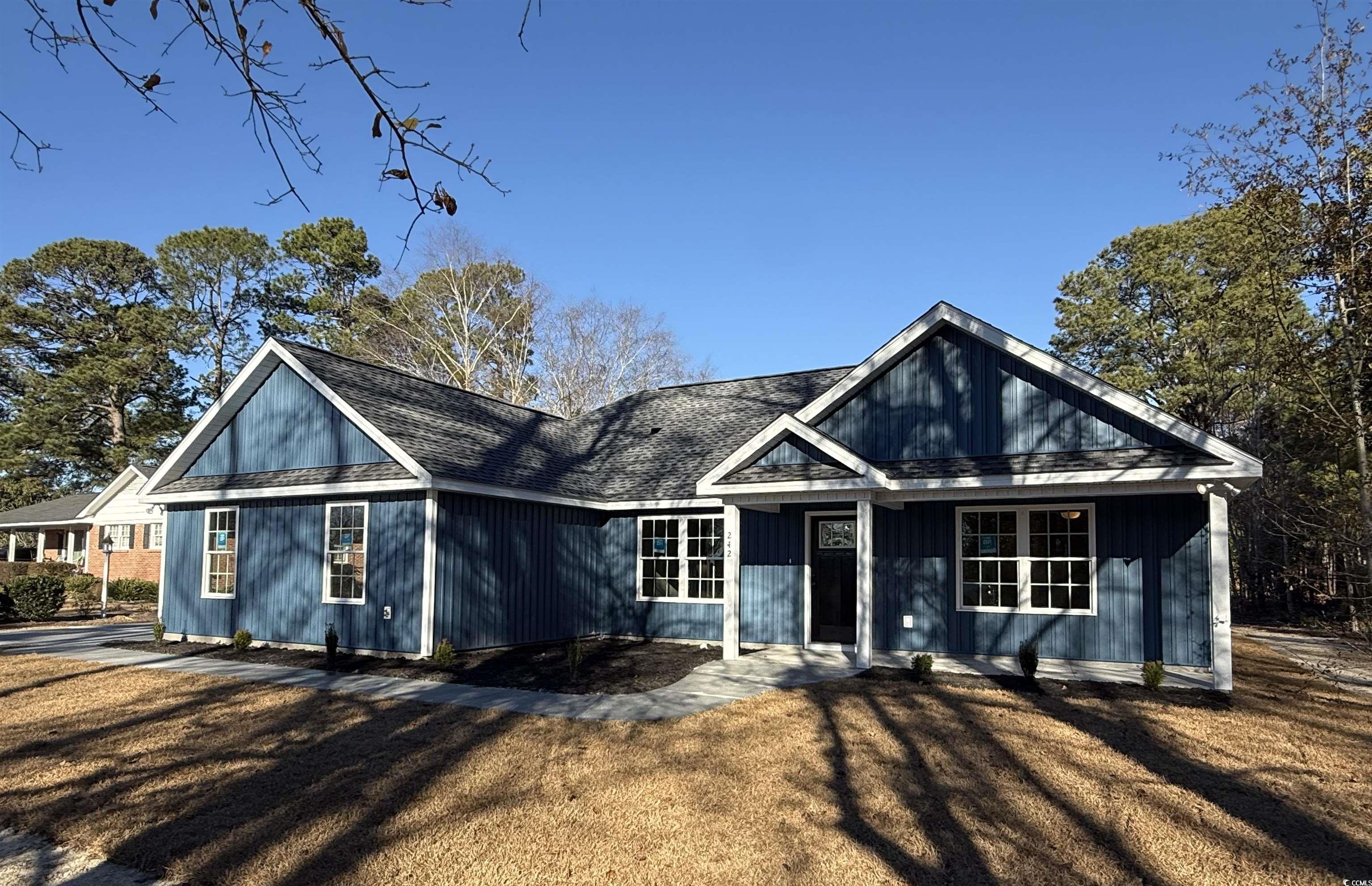 View of front of property featuring a front lawn