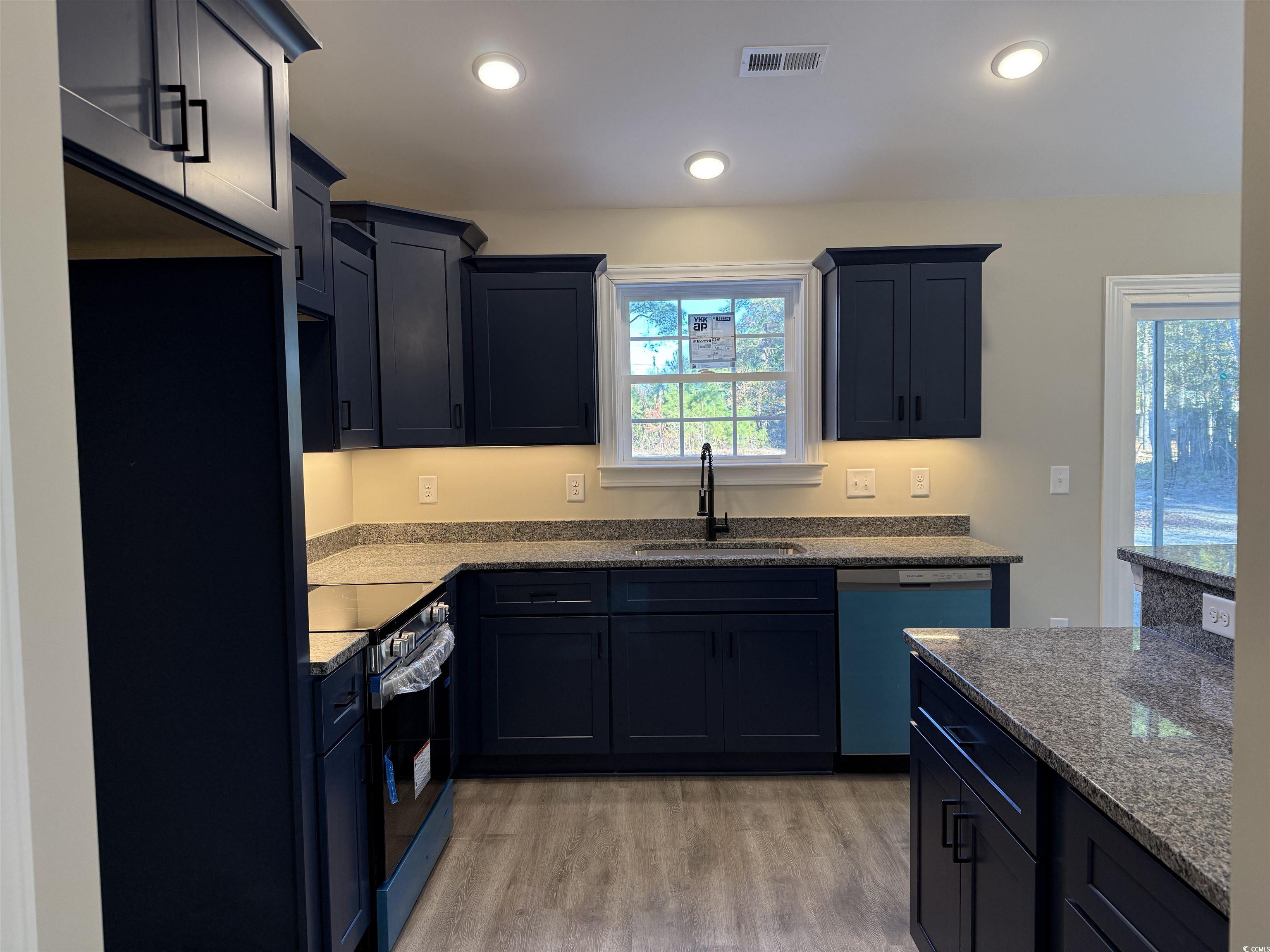 242 Country Club Road Marion, SC 29571 - Photo 16 of 33 Kitchen with light stone counters, stainless steel range with electric stovetop, dishwasher, light wood finished floors, and recessed lighting