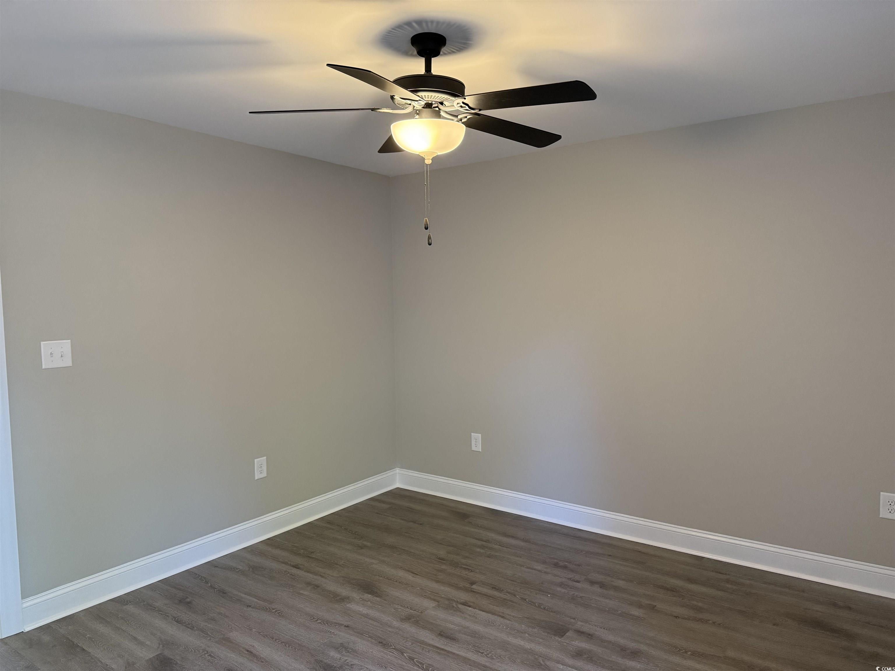242 Country Club Road Marion, SC 29571 - Photo 30 of 33 Empty room featuring dark wood-style flooring and a ceiling fan