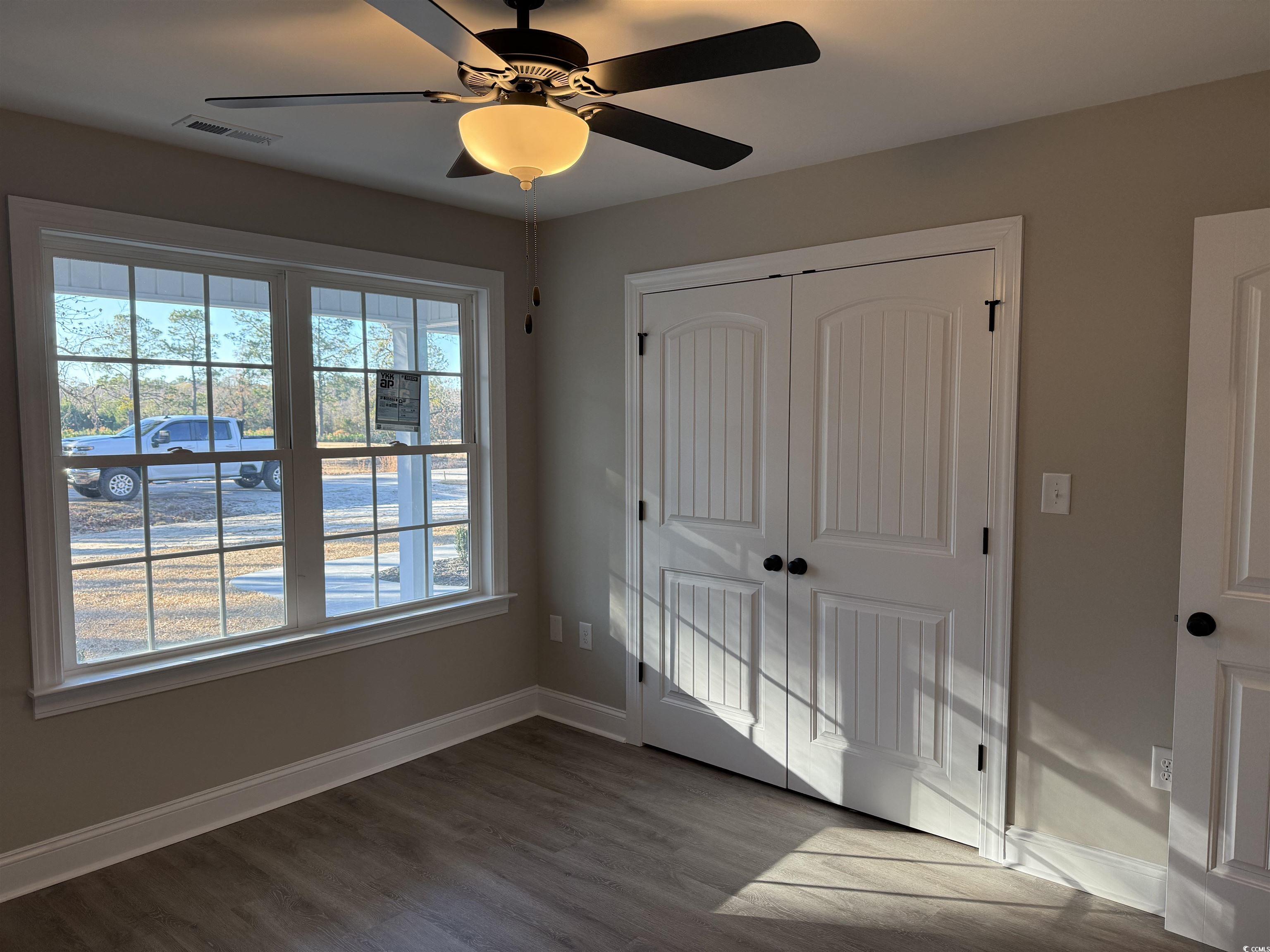 242 Country Club Road Marion, SC 29571 - Photo 31 of 33 Unfurnished bedroom with wood finished floors, a closet, and ceiling fan