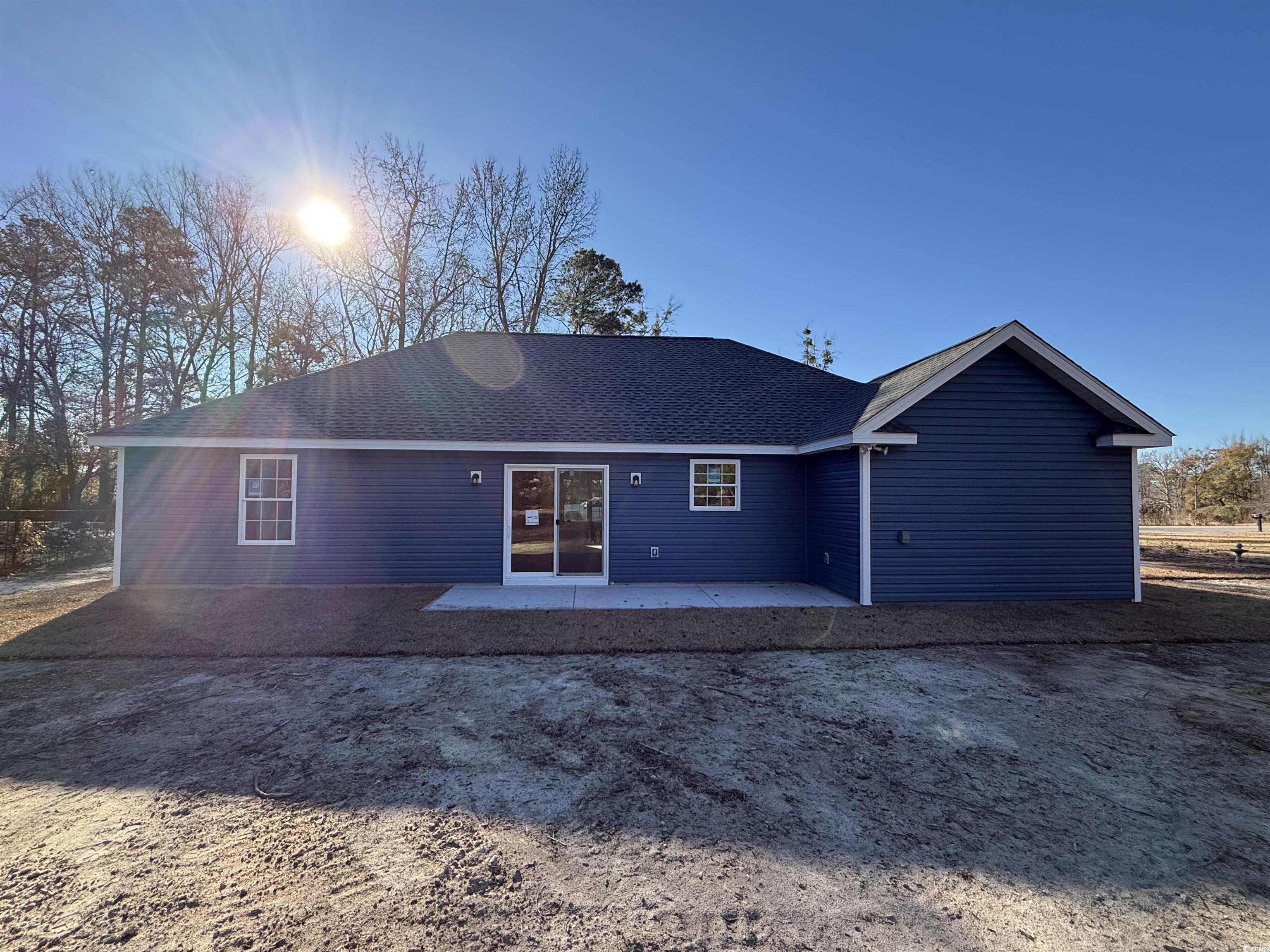 242 Country Club Road Marion, SC 29571 - Photo 4 of 33 Back of house featuring a patio area and roof with shingles