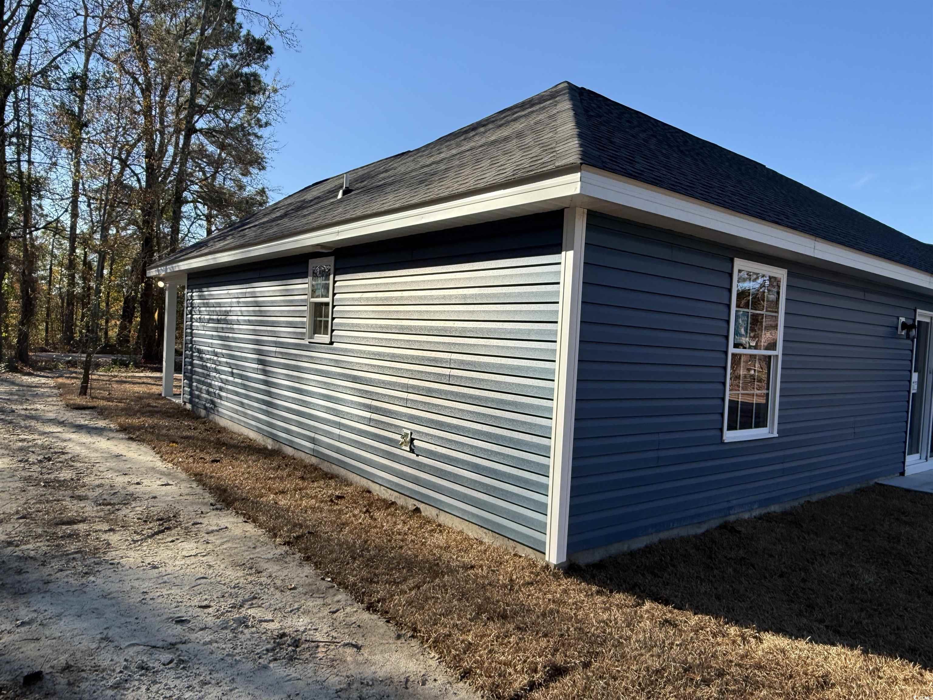 242 Country Club Road Marion, SC 29571 - Photo 5 of 33 View of property exterior with roof with shingles