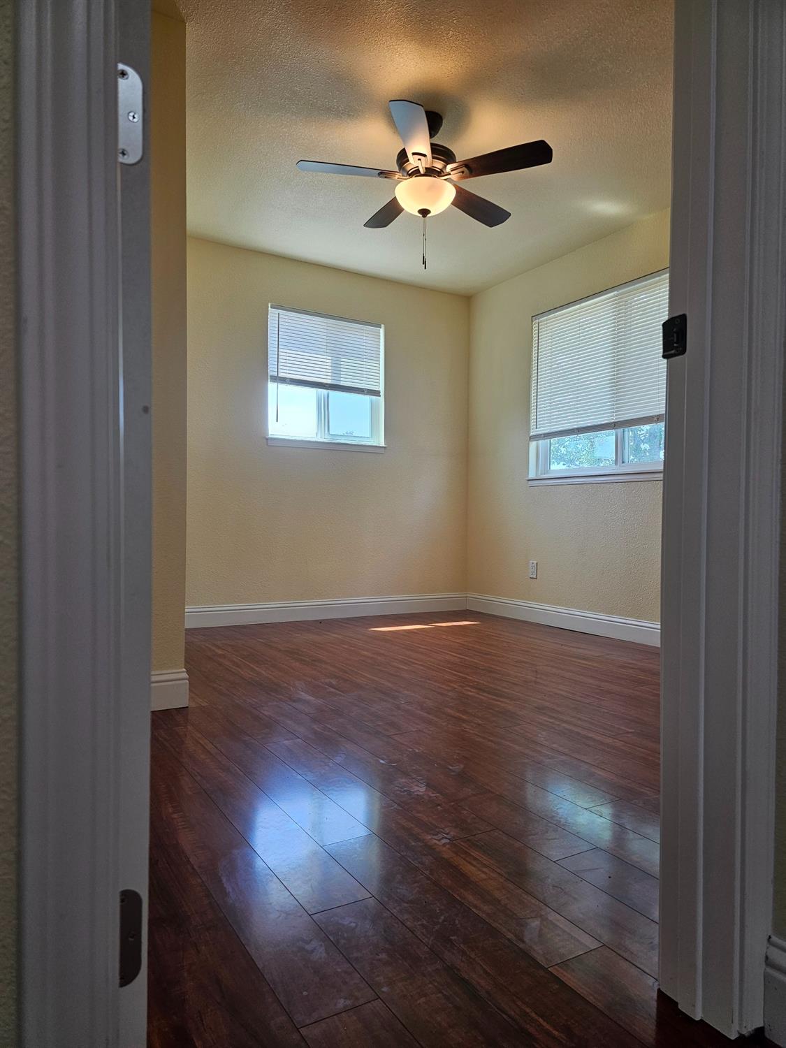 46 Arizona Way Olivehurst, CA 95961 - Photo 11 of 21 a view of a room with wooden floor and a ceiling fan