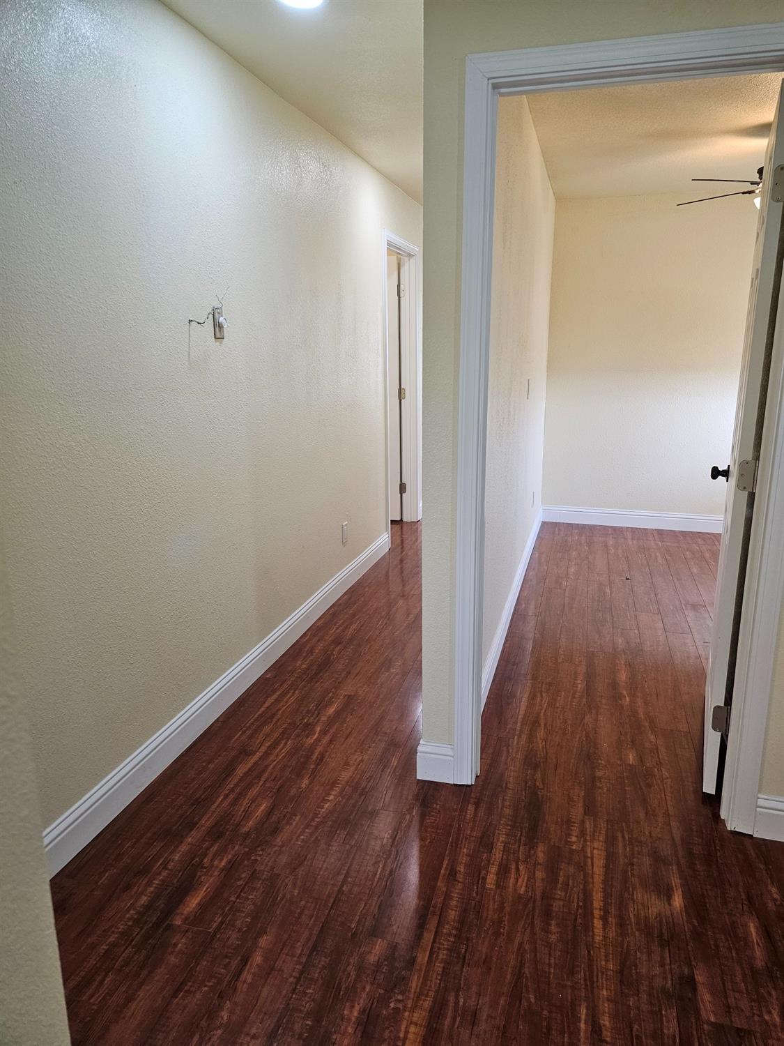 46 Arizona Way Olivehurst, CA 95961 - Photo 14 of 21 a view of a hallway with wooden floor