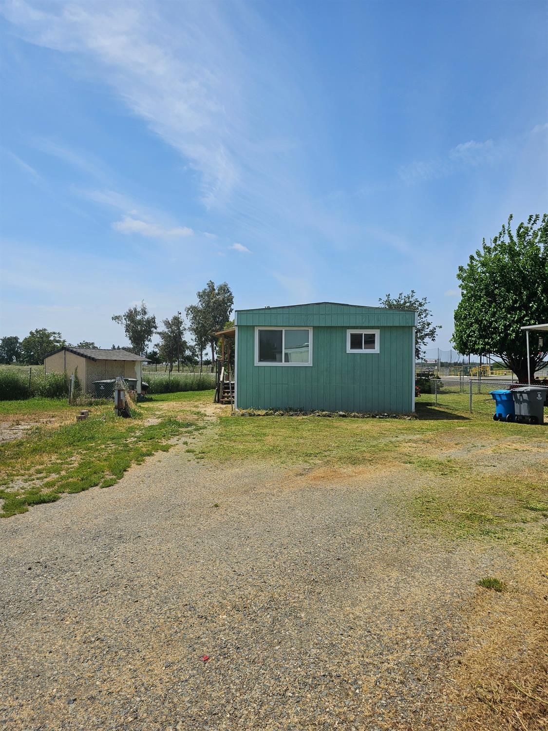 46 Arizona Way Olivehurst, CA 95961 - Photo 21 of 21 a view of a house with a yard and a large tree