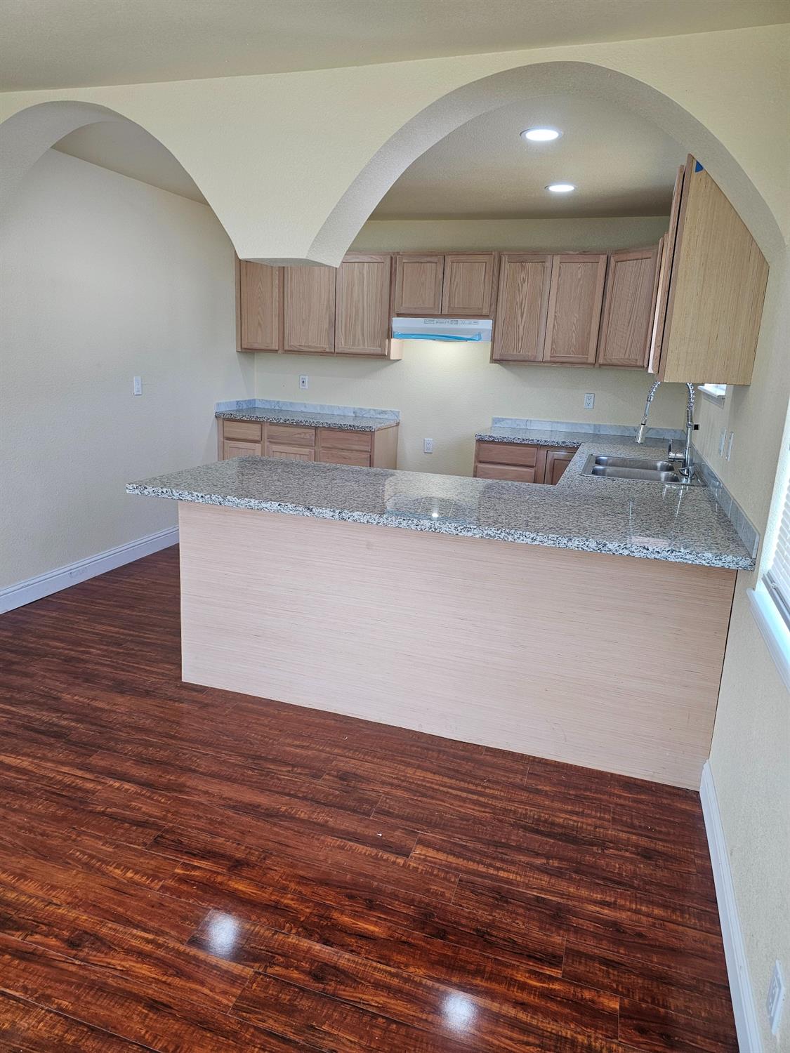 46 Arizona Way Olivehurst, CA 95961 - Photo 5 of 21 a kitchen with granite countertop a sink a stove and cabinets