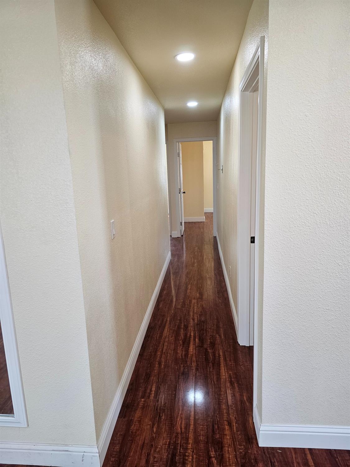 46 Arizona Way Olivehurst, CA 95961 - Photo 6 of 21 a view of a hallway with wooden floor