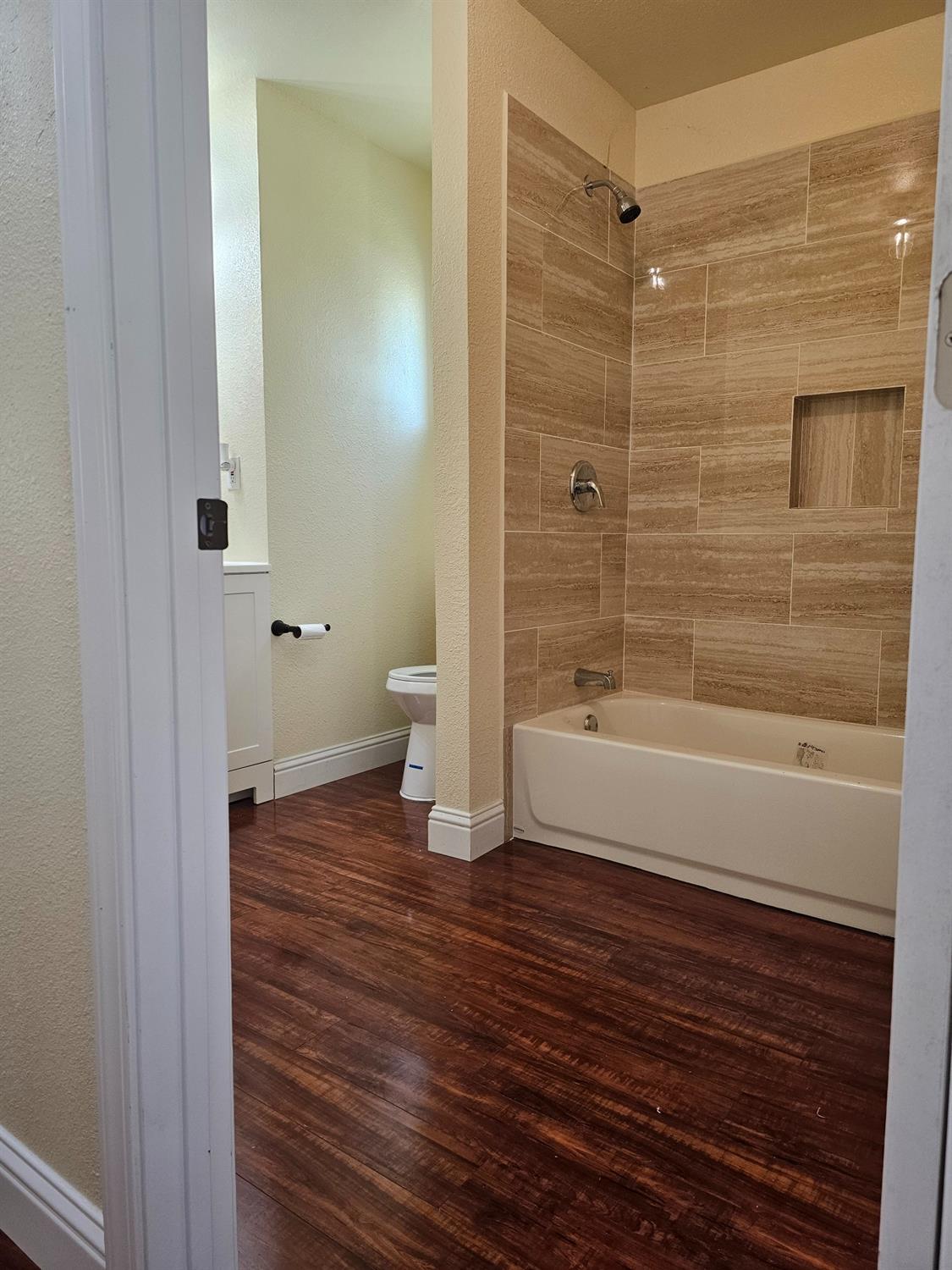 46 Arizona Way Olivehurst, CA 95961 - Photo 7 of 21 a bathroom with a bathtub and a shower