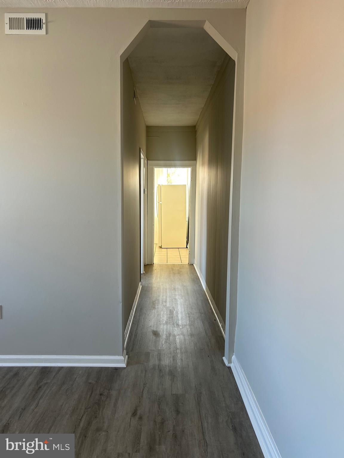 1413 West Baltimore Street, Unit 7 Baltimore, MD 21223 - Photo 3 of 6 a view of a hallway with wooden floor