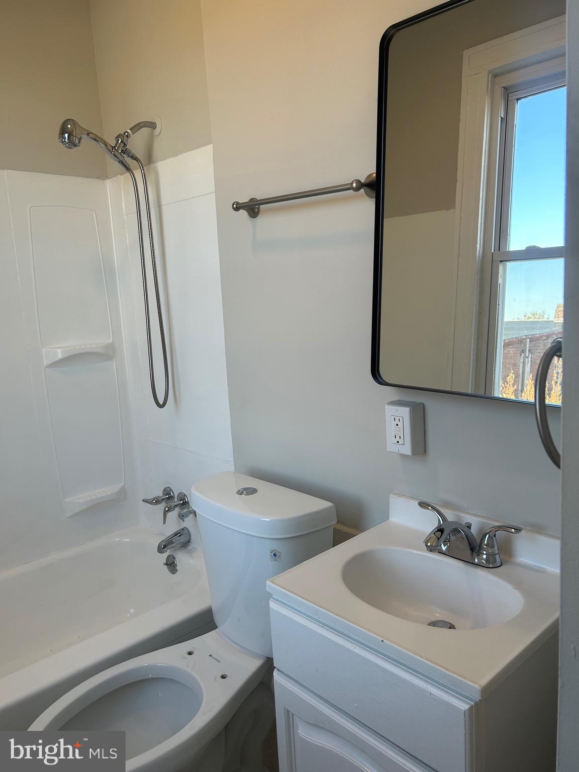 1413 West Baltimore Street, Unit 7 Baltimore, MD 21223 - Photo 5 of 6 a bathroom with a sink toilet and shower