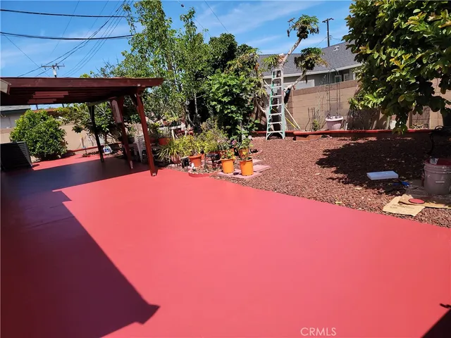 a view of a backyard with sitting area