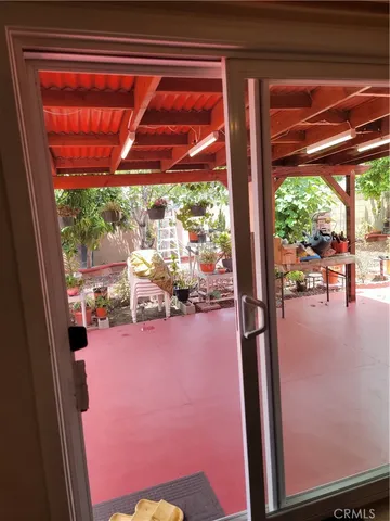 a view of a chairs and table in the patio