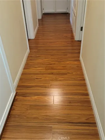 a bathroom with a toilet and a mirror