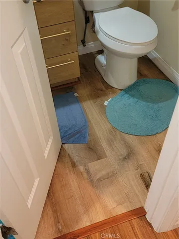 a large kitchen with a refrigerator and cabinets