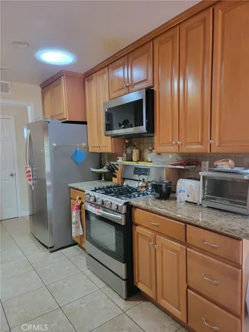 a bathroom with a toilet a sink and a mirror
