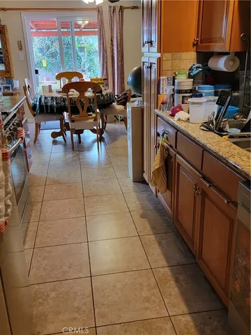 a view of a tables and chairs in back yard of the house