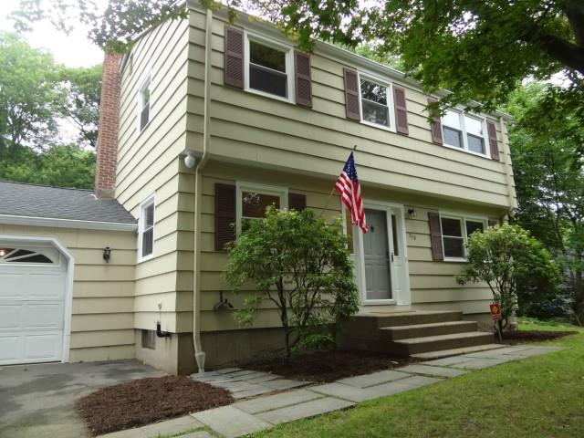 278 Papurah Road Fairfield, CT 06825 - Photo 1 of 1 a front view of a house with a yard