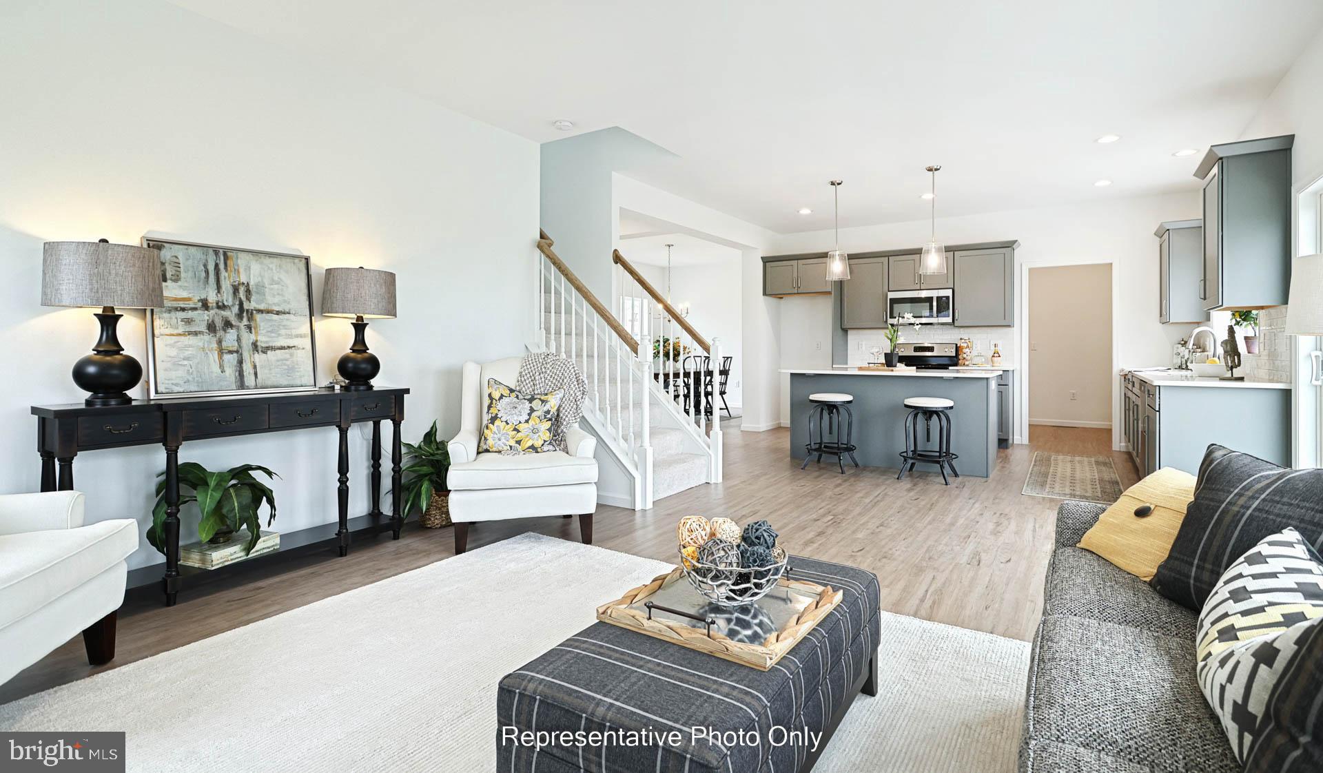 828 Kimmerlings Road Lebanon, PA 17046 - Photo 12 of 24 a living room with furniture kitchen view and a wooden floor