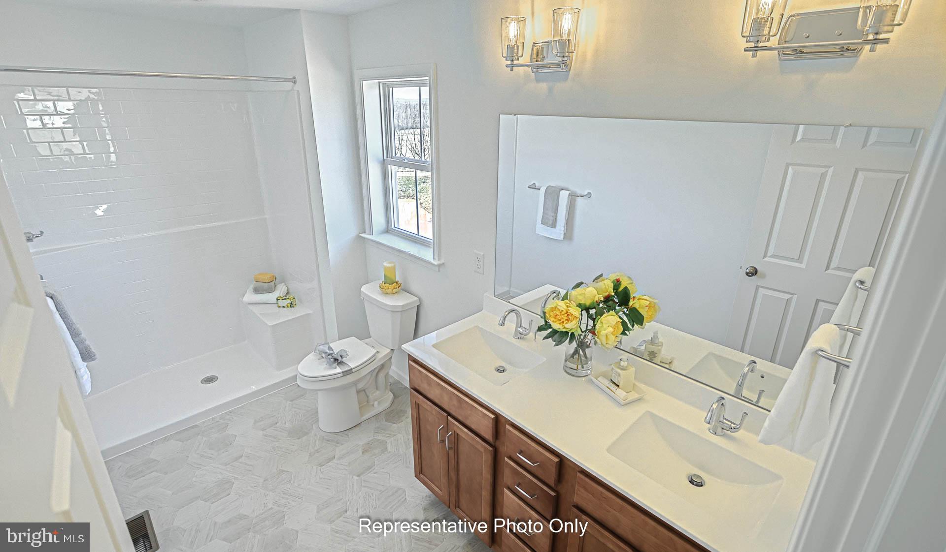 828 Kimmerlings Road Lebanon, PA 17046 - Photo 17 of 24 a bathroom with a sink toilet and shower