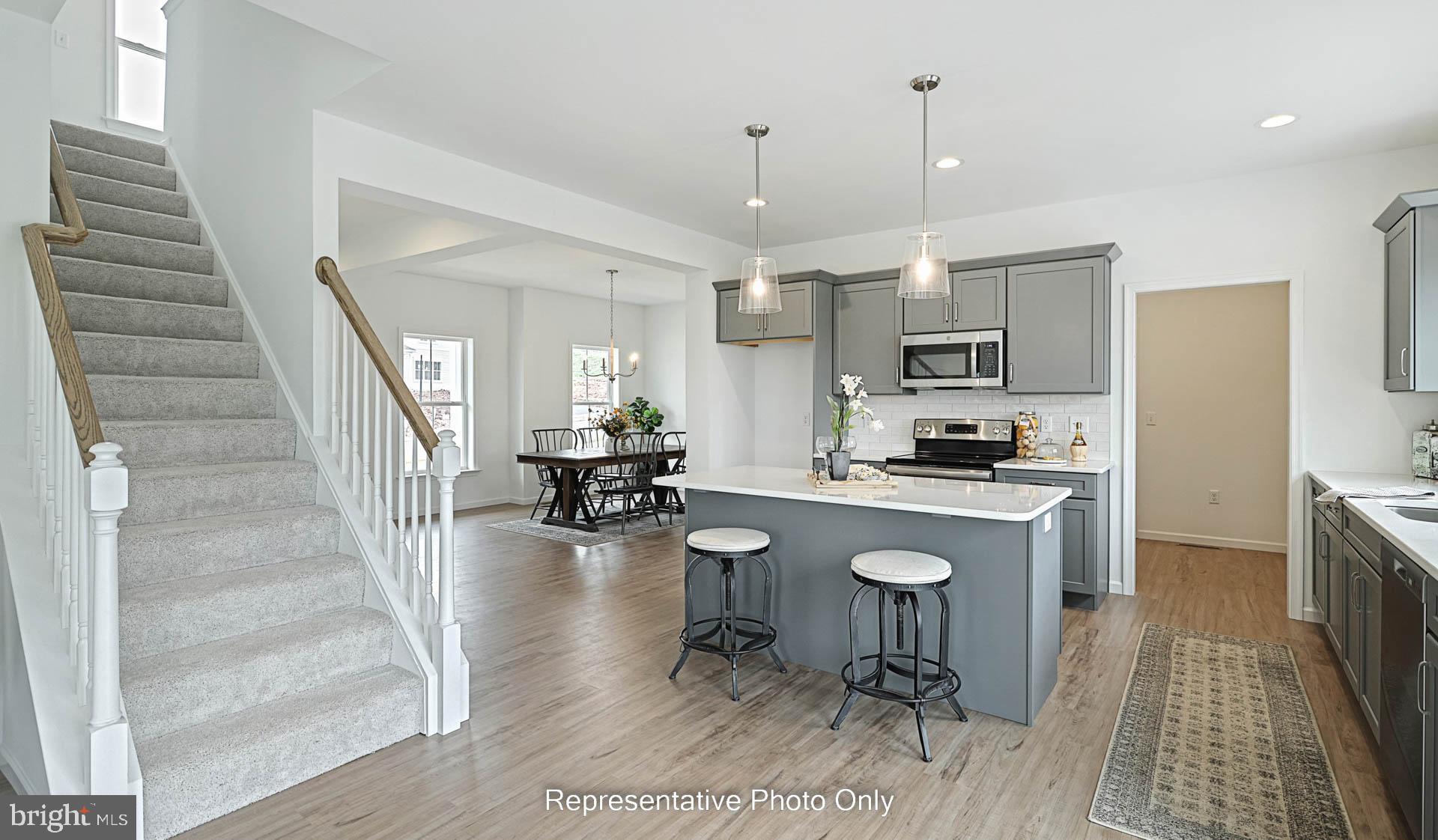 828 Kimmerlings Road Lebanon, PA 17046 - Photo 9 of 24 a kitchen with sink refrigerator dining table and chairs