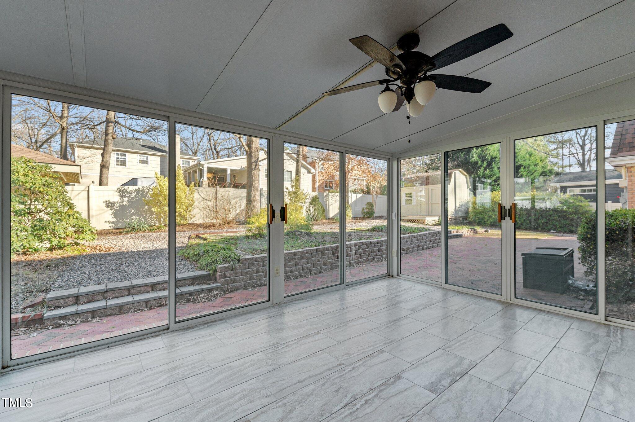 4712 Scollay Court Raleigh, NC 27609 - Photo 23 of 32 Beautiful view of fenced in backyard from the Sunroom