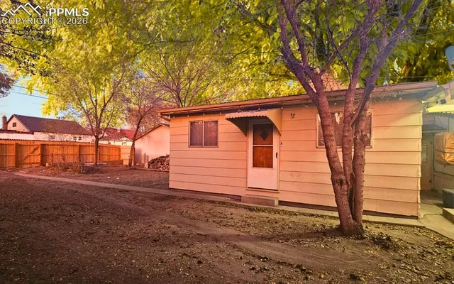 a small space with a tree in the background