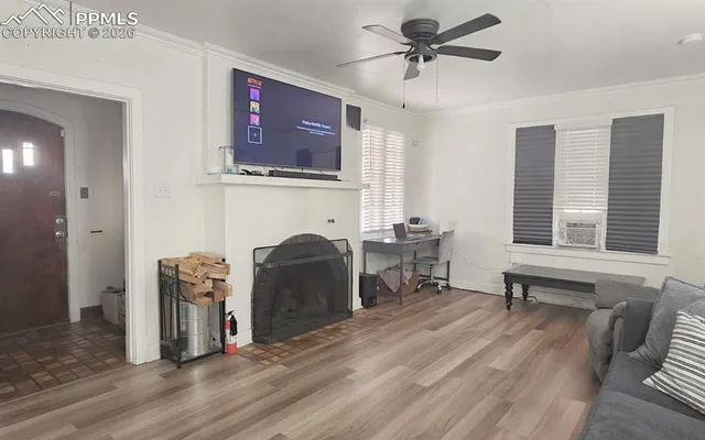 a view of a livingroom with furniture and a window