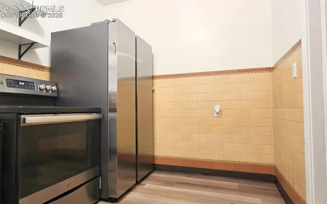 a bathroom with a shower and a mirror