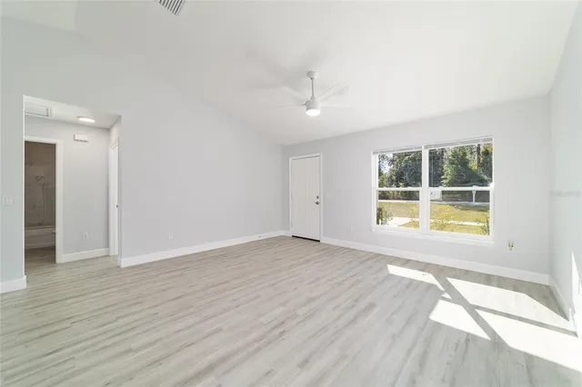 a view of an empty room with a window