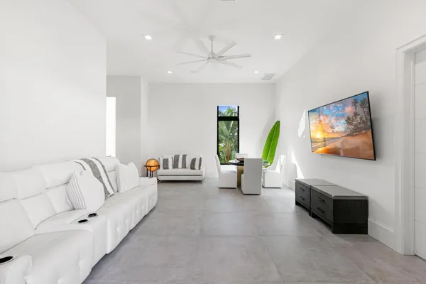 a living room with furniture and a large window