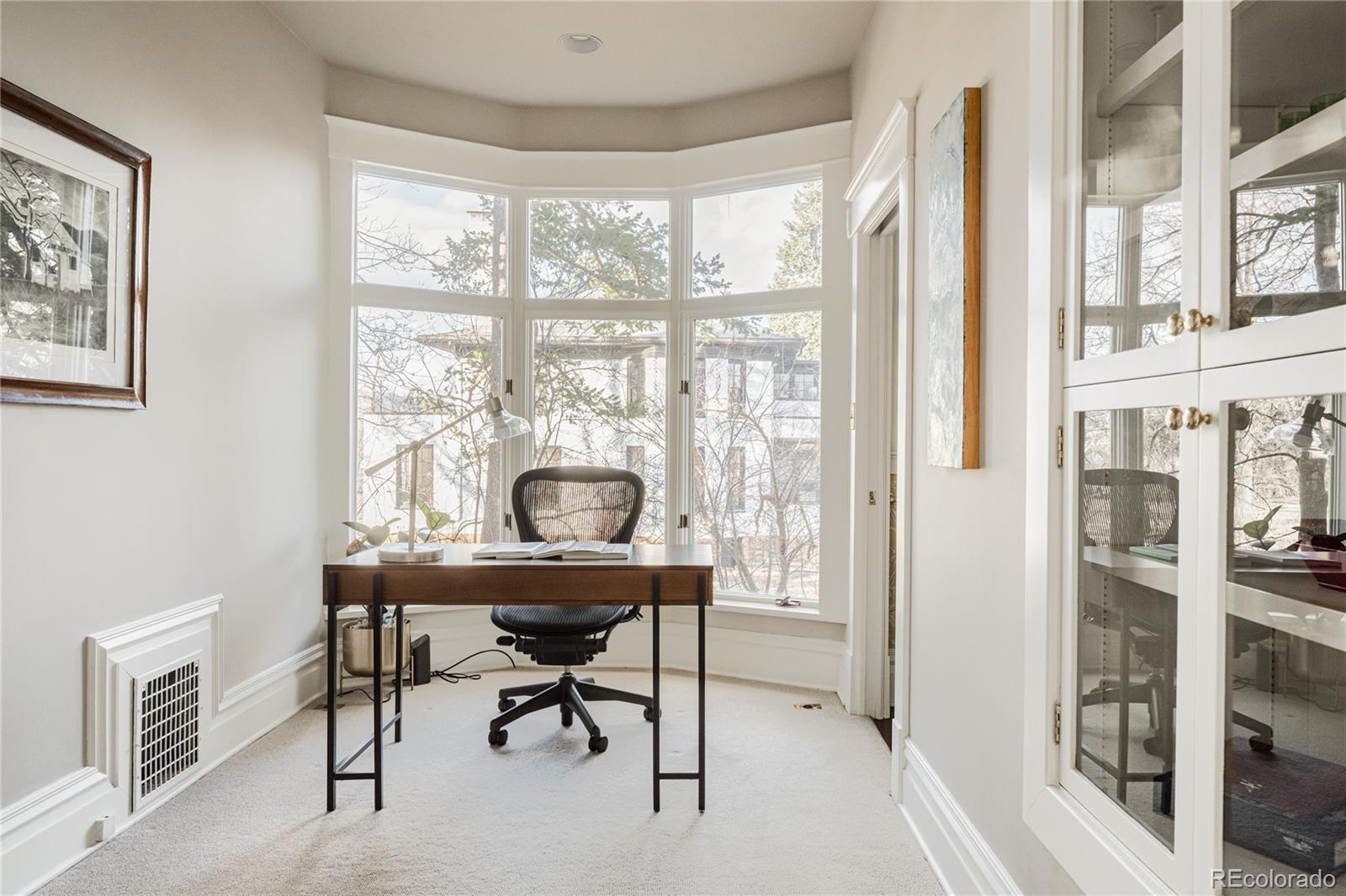 870 12th Street Boulder, CO 80302 - Photo 11 of 34 a workspace with furniture and a window
