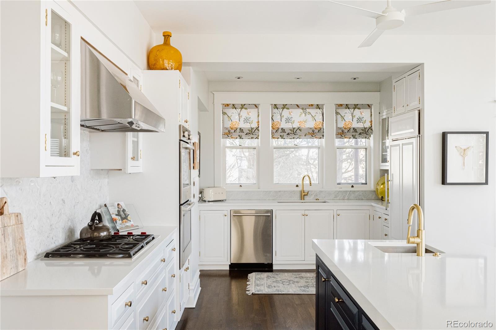 870 12th Street Boulder, CO 80302 - Photo 14 of 34 a kitchen with a sink a stove and cabinets