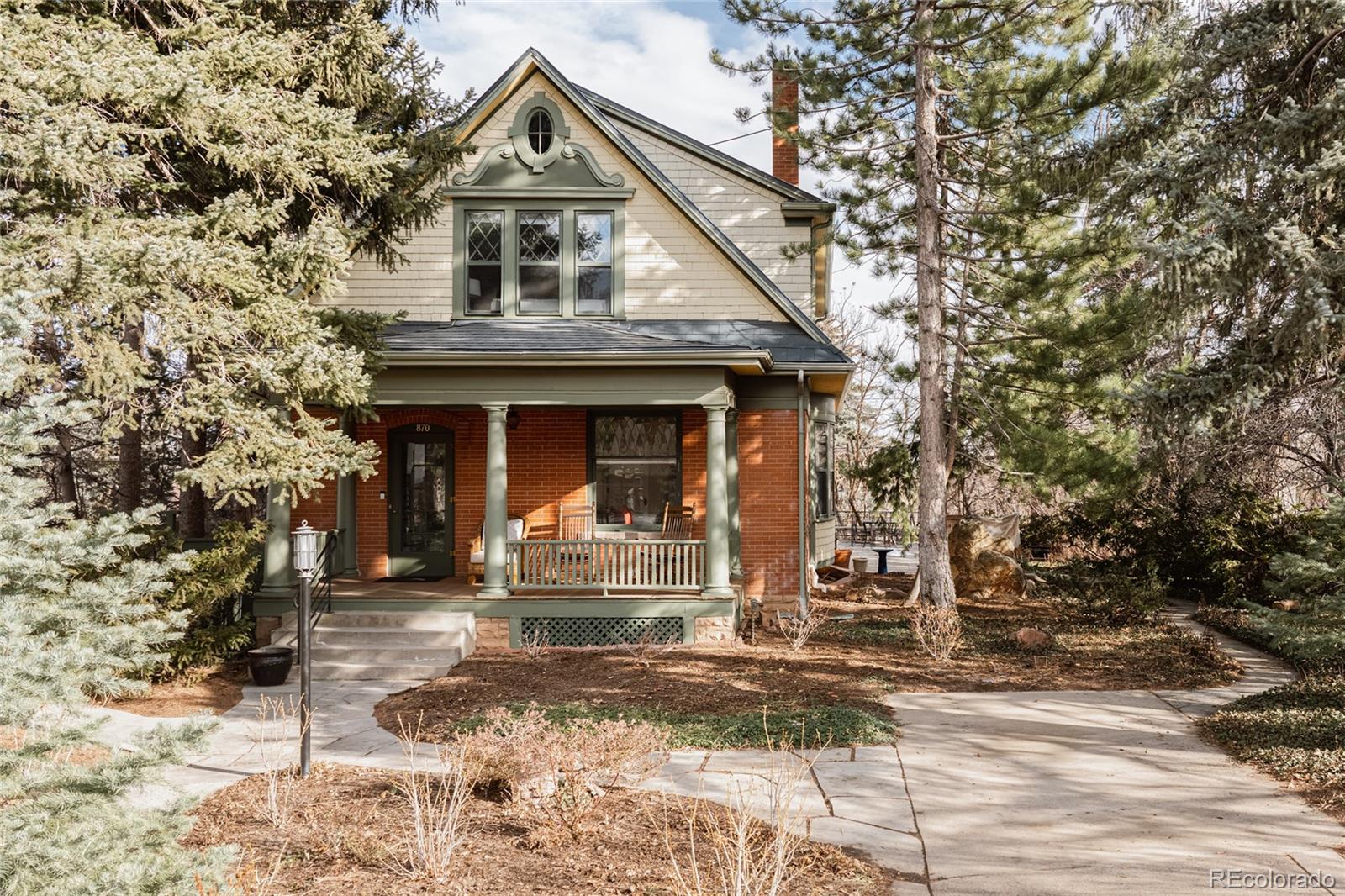 870 12th Street Boulder, CO 80302 - Photo 2 of 34 a front view of a house with a yard