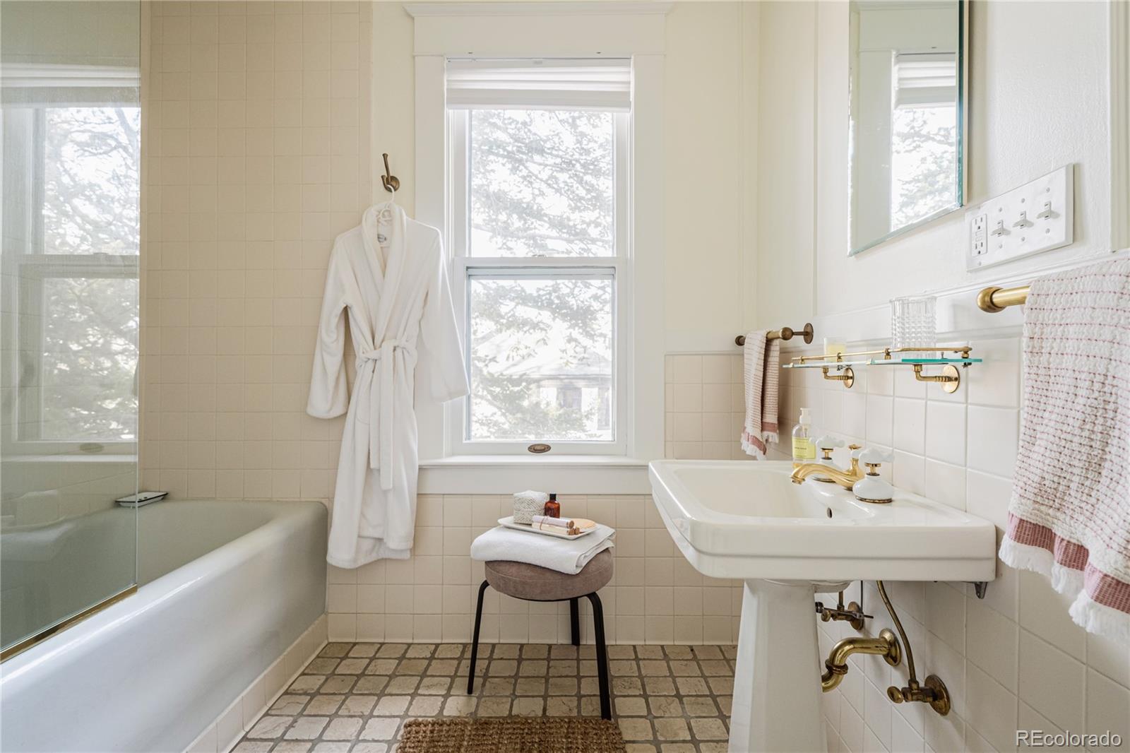 870 12th Street Boulder, CO 80302 - Photo 25 of 34 a bathroom with a sink a bathtub and a window