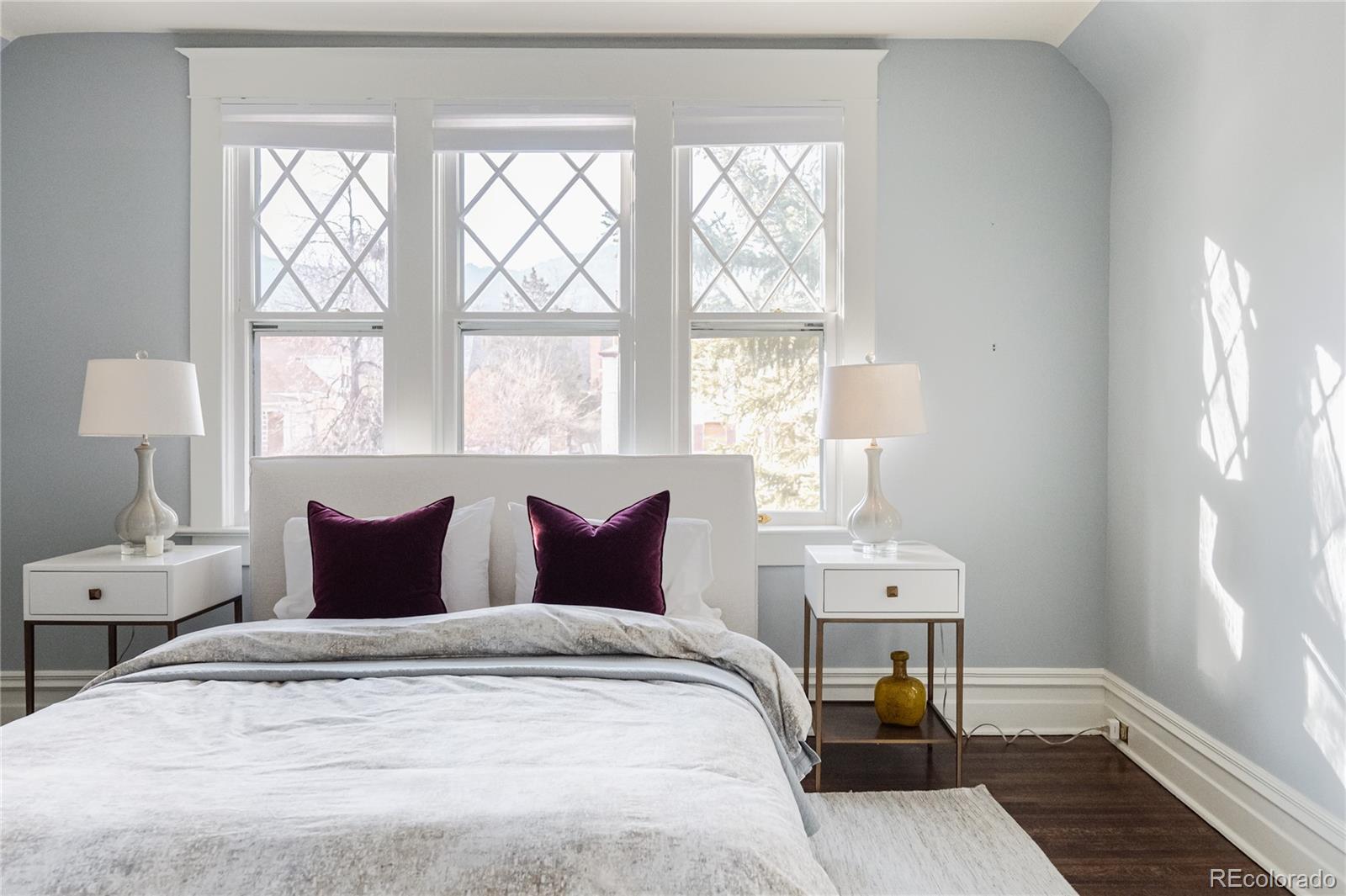 870 12th Street Boulder, CO 80302 - Photo 27 of 34 a bedroom with a bed and wooden floor