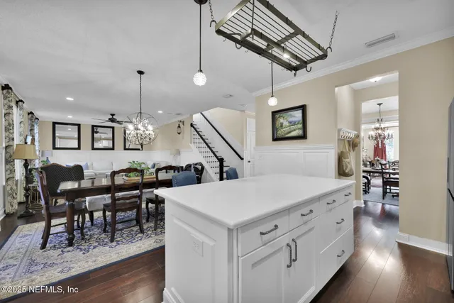a kitchen with a table and chairs in it