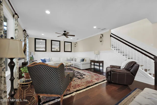 a view of a balcony with furniture and chandelier