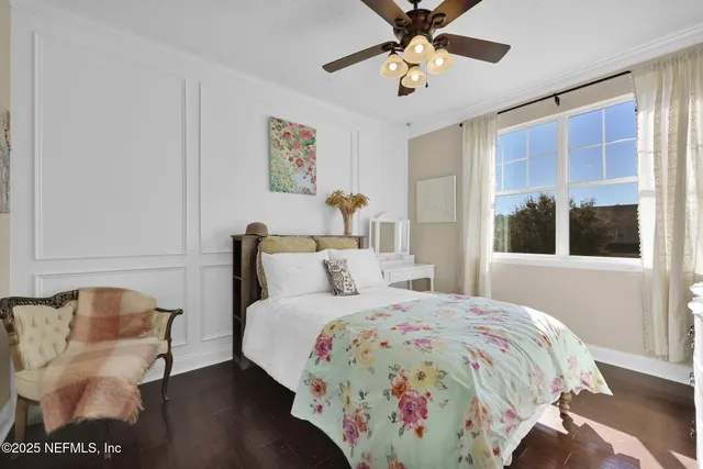 a bedroom with furniture and a window