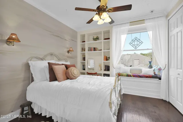 a bathroom with a double vanity sink mirror and bathtub
