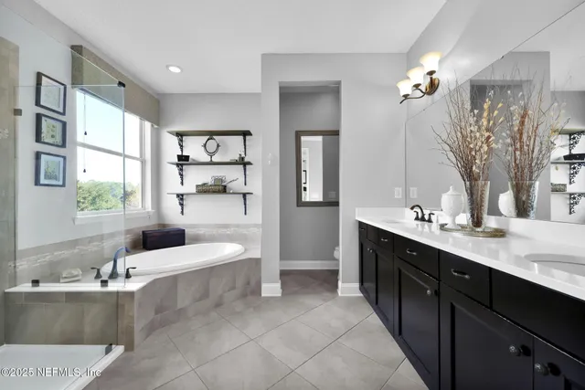 a bathroom with a double vanity sink and a mirror