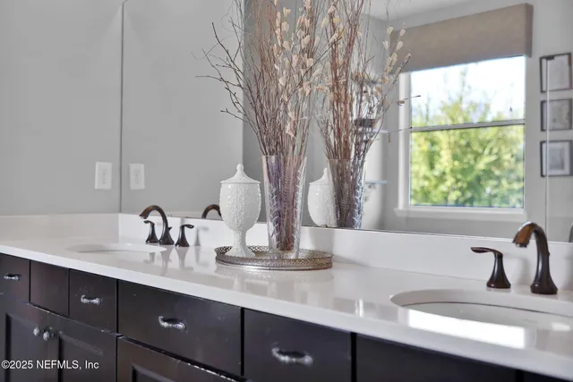 a living room with patio furniture and a floor to ceiling window